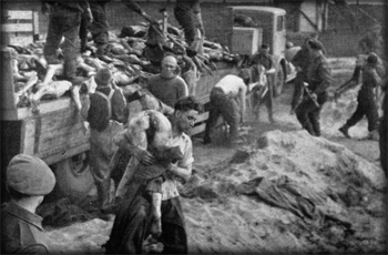 S.S. men taking corpses from lorries to the mass graves 